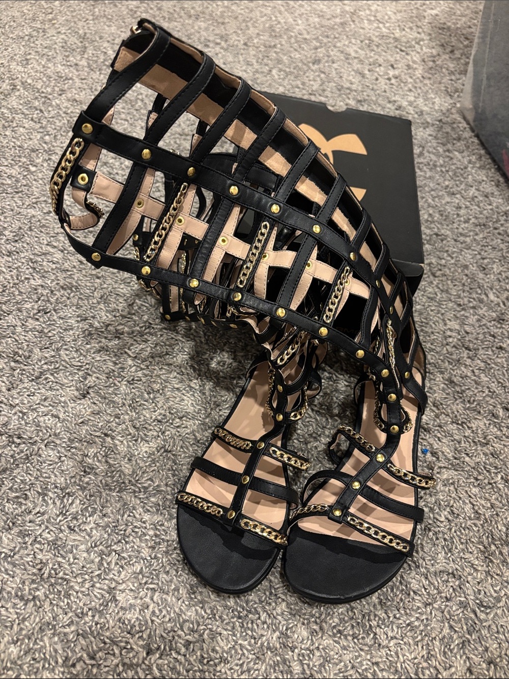 bebe Black Gladiator Sandals with Gold Chain Accents